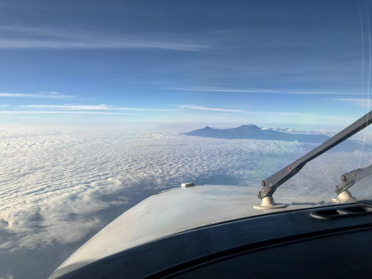 View from a Westwind Aviation flight deck over cloud cover in East Africa